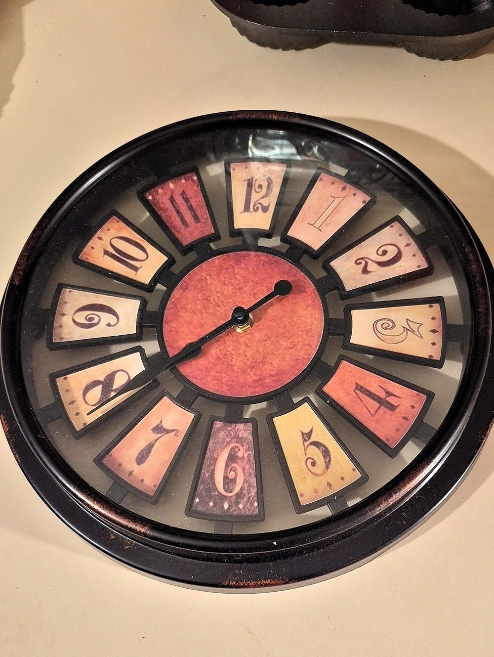 12 Inch Round Numeral Wall Clock Browns And Rust Colored Battery Operated